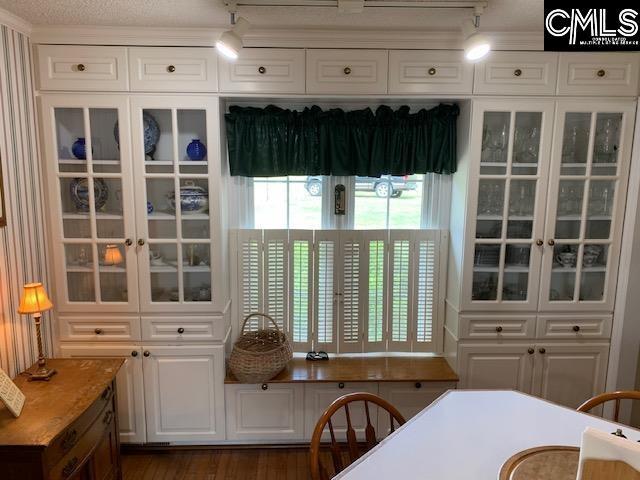 223 Cammack Rd, Winnsboro, SC 29180 - dining room featuring track lighting and dark wood finished floors