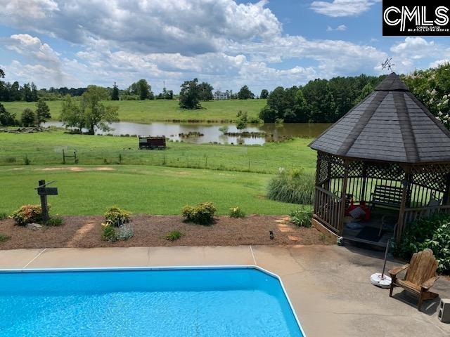 223 Cammack Rd, Winnsboro, SC 29180 - swimming pool featuring a gazebo, a lawn, a water view, and a patio area