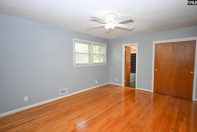 1120 Garden Ave, Cayce, SC 29033 - unfurnished bedroom featuring light wood-style flooring, a closet, a ceiling fan, and ensuite bath