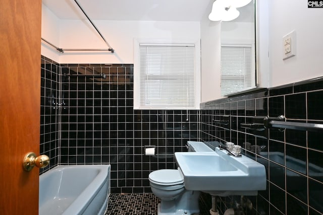 1120 Garden Ave, Cayce, SC 29033 - bathroom featuring tile walls, tile patterned floors, a wainscoted wall, and bathtub / shower combination
