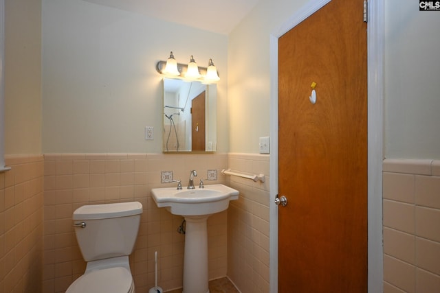 1120 Garden Ave, Cayce, SC 29033 - half bathroom with tile walls and a wainscoted wall