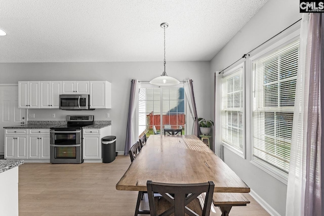 218 Founders Ridge Rd, Columbia, SC 29229 - dining area featuring a textured ceiling and light wood finished floors