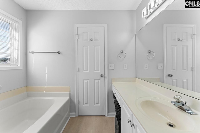 218 Founders Ridge Rd, Columbia, SC 29229 - full bathroom with wood finished floors, vanity, and a bath