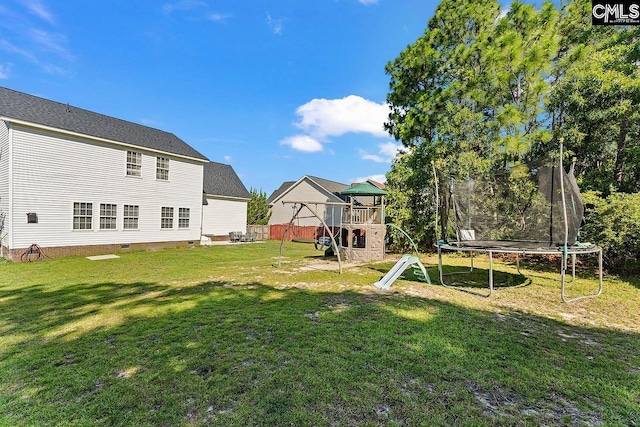 218 Founders Ridge Rd, Columbia, SC 29229 - view of grassy yard with a trampoline and a playground