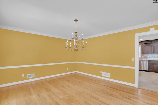 2432 Bermuda Hills Rd, Columbia, SC 29223 - unfurnished room with a chandelier, light wood-type flooring, and ornamental molding