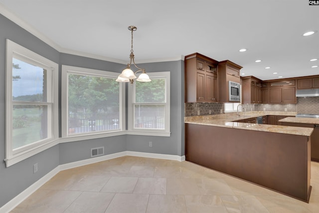 2432 Bermuda Hills Rd, Columbia, SC 29223 - kitchen featuring under cabinet range hood, backsplash, light stone countertops, a peninsula, and hanging light fixtures