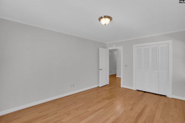 2432 Bermuda Hills Rd, Columbia, SC 29223 - unfurnished bedroom with crown molding, light wood-type flooring, and a closet