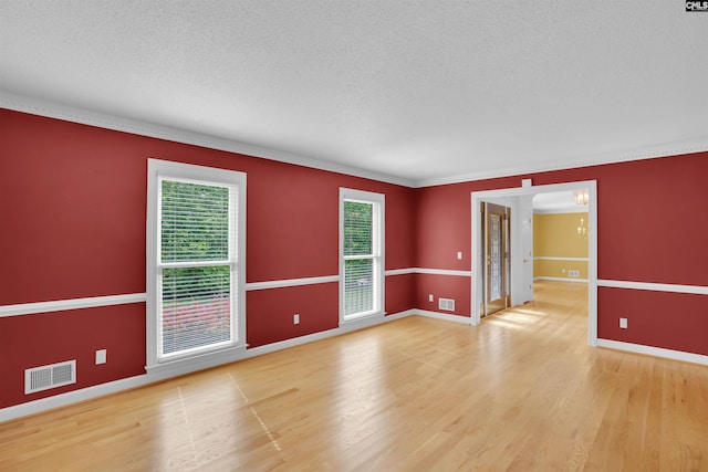 2432 Bermuda Hills Rd, Columbia, SC 29223 - spare room with a textured ceiling, light wood finished floors, and ornamental molding