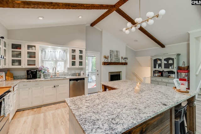 330 Grantham Rd, Irmo, SC 29063 - kitchen with dishwasher, light stone countertops, white cabinetry, and a center island