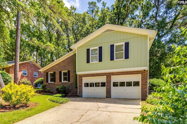 330 Grantham Rd, Irmo, SC 29063 - tri-level home featuring brick siding, driveway, and a garage