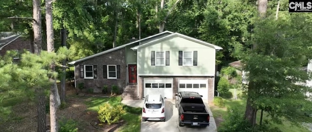 330 Grantham Rd, Irmo, SC 29063 - tri-level home featuring brick siding, an attached garage, and driveway