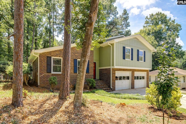330 Grantham Rd, Irmo, SC 29063 - split level home featuring an attached garage, driveway, and brick siding
