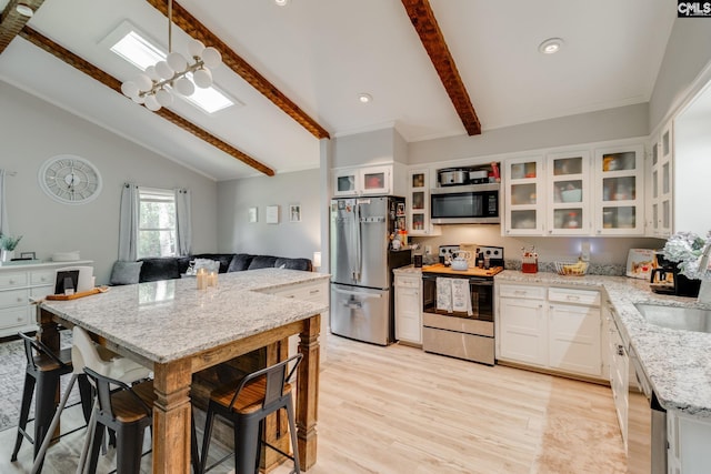 330 Grantham Rd, Irmo, SC 29063 - kitchen featuring stainless steel appliances, light wood-type flooring, light stone counters, white cabinetry, and recessed lighting