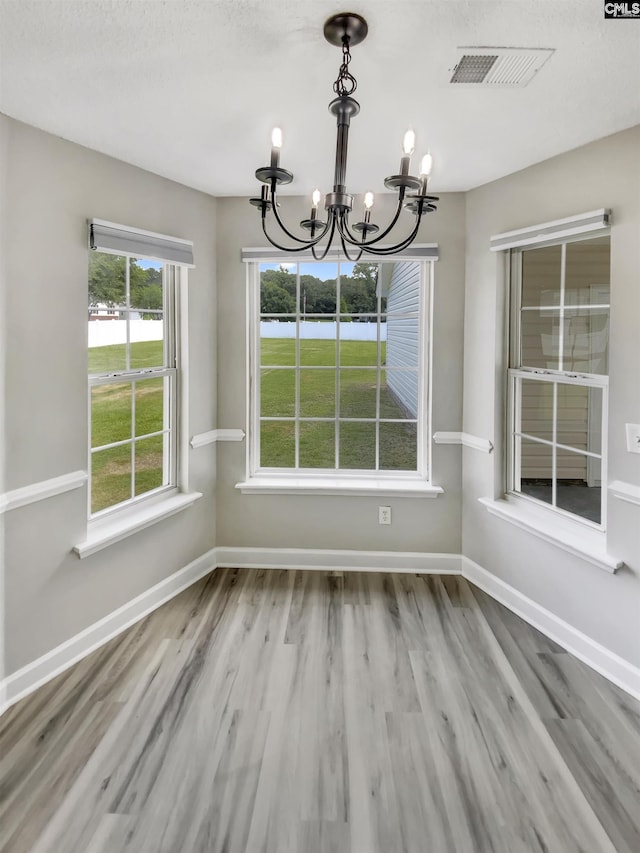 1524 Highway Church Rd, Elgin, SC 29045 - unfurnished dining area featuring a chandelier, wood finished floors, and a water view