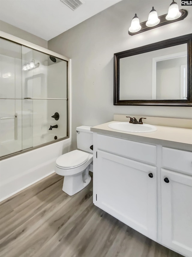 1524 Highway Church Rd, Elgin, SC 29045 - full bath with wood finished floors, vanity, and bath / shower combo with glass door