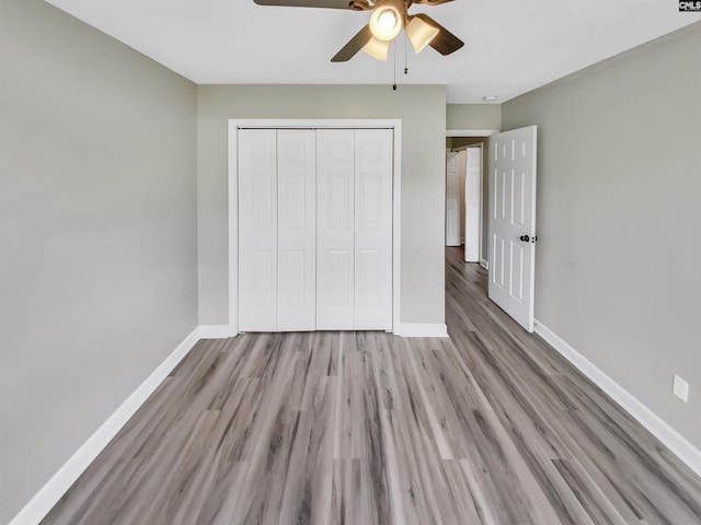 1524 Highway Church Rd, Elgin, SC 29045 - unfurnished bedroom with wood finished floors, a closet, and ceiling fan