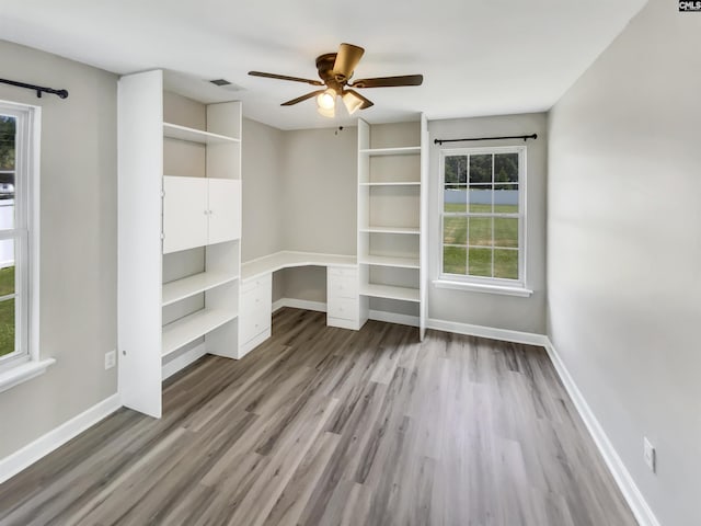 1524 Highway Church Rd, Elgin, SC 29045 - empty room featuring wood finished floors, ceiling fan, and built in study area