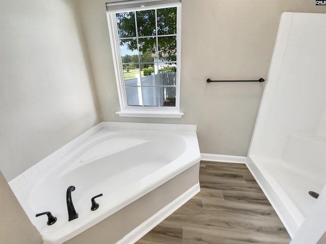 1524 Highway Church Rd, Elgin, SC 29045 - bathroom featuring wood finished floors, a bath, and a shower