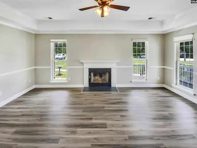 1524 Highway Church Rd, Elgin, SC 29045 - unfurnished living room featuring healthy amount of natural light, wood finished floors, ceiling fan, a fireplace with flush hearth, and crown molding