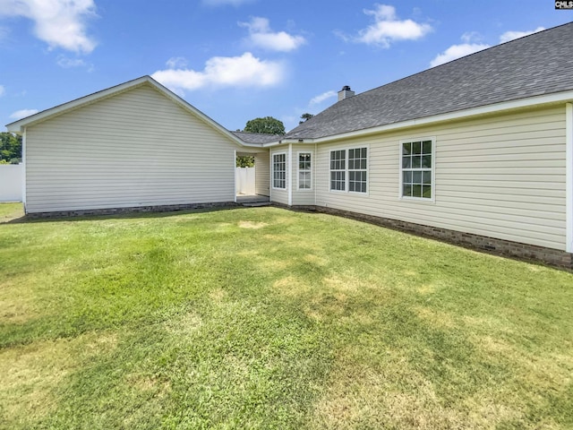 1524 Highway Church Rd, Elgin, SC 29045 - rear view of house featuring a shingled roof, a yard, and a chimney