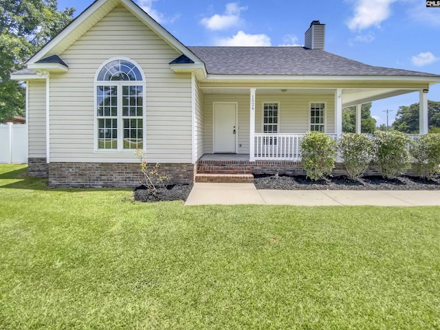 1524 Highway Church Rd, Elgin, SC 29045 - view of front of home featuring a shingled roof, covered porch, a front lawn, and a chimney