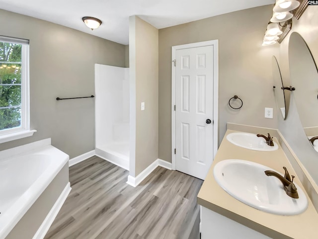 1524 Highway Church Rd, Elgin, SC 29045 - full bathroom featuring double vanity, a garden tub, wood finished floors, and a walk in shower