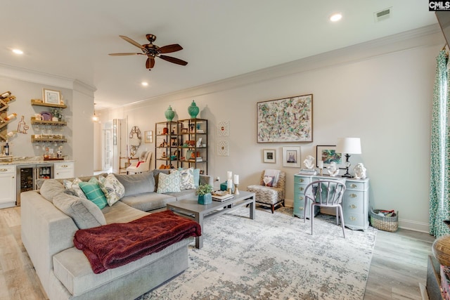6150 Crabtree Rd, Columbia, SC 29206 - living area with wine cooler, crown molding, a dry bar, ceiling fan, and light wood-style flooring