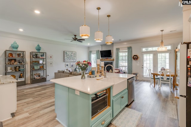 6150 Crabtree Rd, Columbia, SC 29206 - kitchen featuring green cabinetry, stainless steel dishwasher, freestanding refrigerator, ceiling fan, and open floor plan