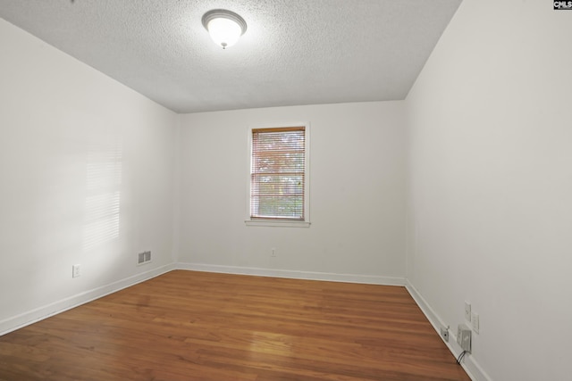 227 Latonea Dr, Columbia, SC 29210 - empty room with wood finished floors and a textured ceiling