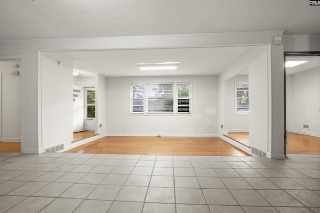 227 Latonea Dr, Columbia, SC 29210 - spare room with light tile patterned floors and a textured ceiling