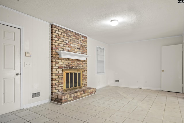 227 Latonea Dr, Columbia, SC 29210 - unfurnished living room featuring a textured ceiling, crown molding, a fireplace, and light tile patterned floors