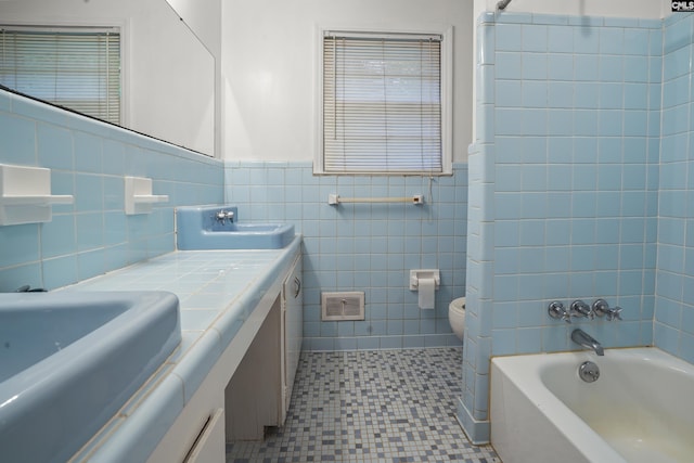 227 Latonea Dr, Columbia, SC 29210 - full bathroom featuring tile walls, vanity, wainscoting, bathing tub / shower combination, and tile patterned floors