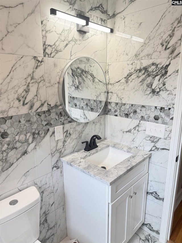 1341 Sanford Rd, Columbia, SC 29206 - half bathroom featuring tile walls, vanity, and marble finish flooring