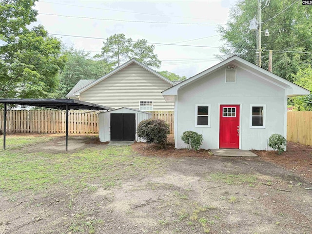1341 Sanford Rd, Columbia, SC 29206 - view of shed featuring a fenced backyard and a carport