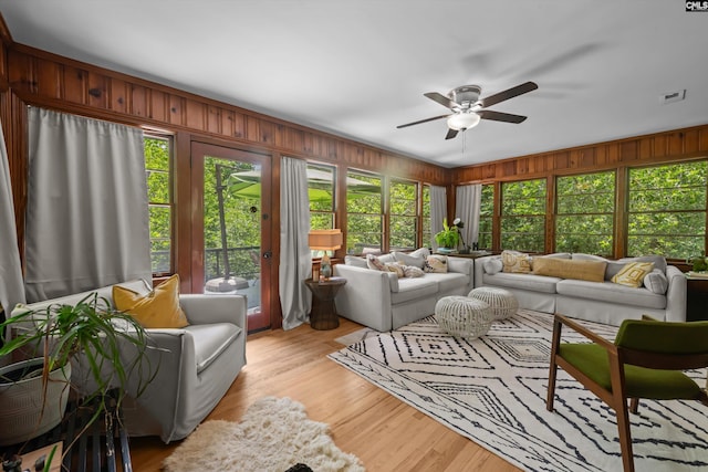 110 Summerlea Dr, Columbia, SC 29203 - living area featuring a ceiling fan, wood walls, and light wood-style flooring