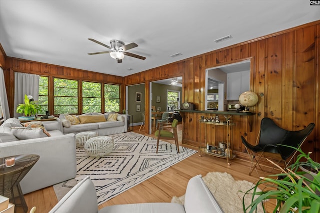 110 Summerlea Dr, Columbia, SC 29203 - living room with ceiling fan, wooden walls, and wood finished floors