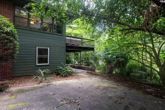 110 Summerlea Dr, Columbia, SC 29203 - view of property exterior featuring a patio, brick siding, and a wooden deck