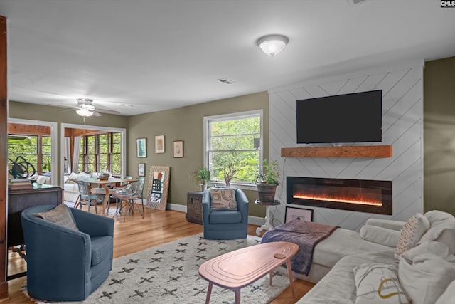 110 Summerlea Dr, Columbia, SC 29203 - living area featuring wood finished floors, a fireplace, plenty of natural light, and a ceiling fan