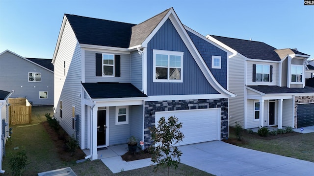15 Runelle Ln, Columbia, SC 29229 - view of front of house featuring driveway, a garage, board and batten siding, and stone siding