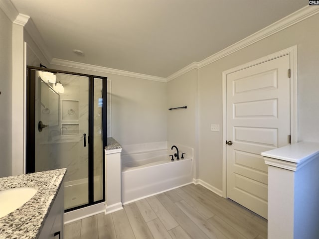15 Runelle Ln, Columbia, SC 29229 - bathroom featuring a bath, a shower stall, vanity, wood finished floors, and crown molding