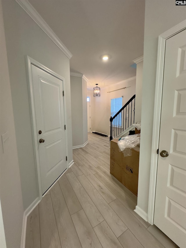 15 Runelle Ln, Columbia, SC 29229 - corridor featuring ornamental molding, stairs, light wood-style floors, and a chandelier