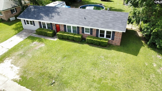 704 Cambridge, Lugoff, SC 29078 - view of front of property featuring brick siding, a front lawn, and roof with shingles