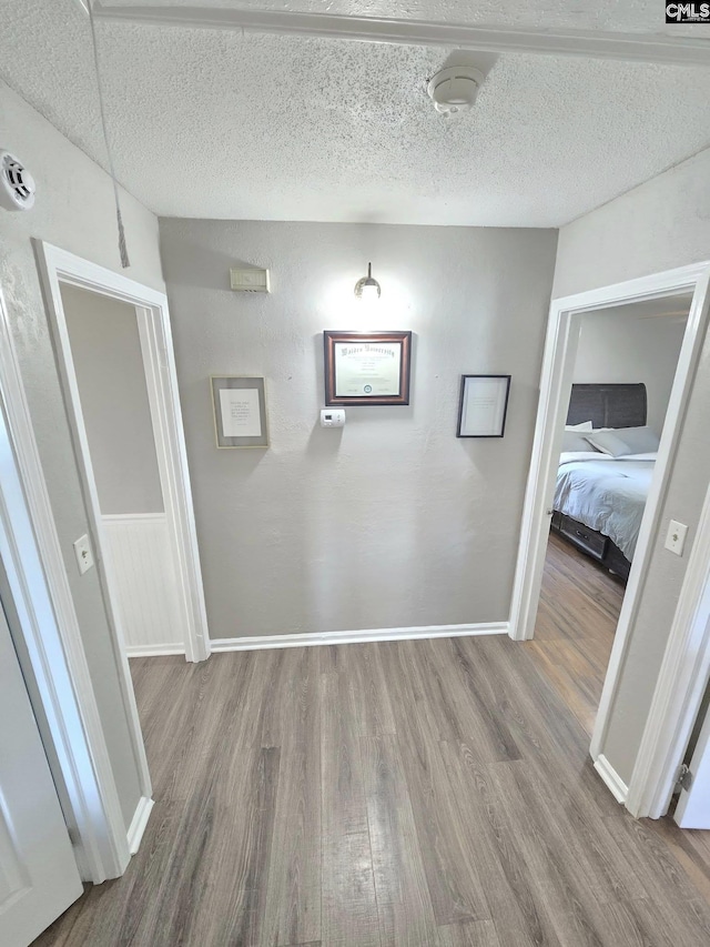 704 Cambridge, Lugoff, SC 29078 - hall with wood finished floors and a textured ceiling