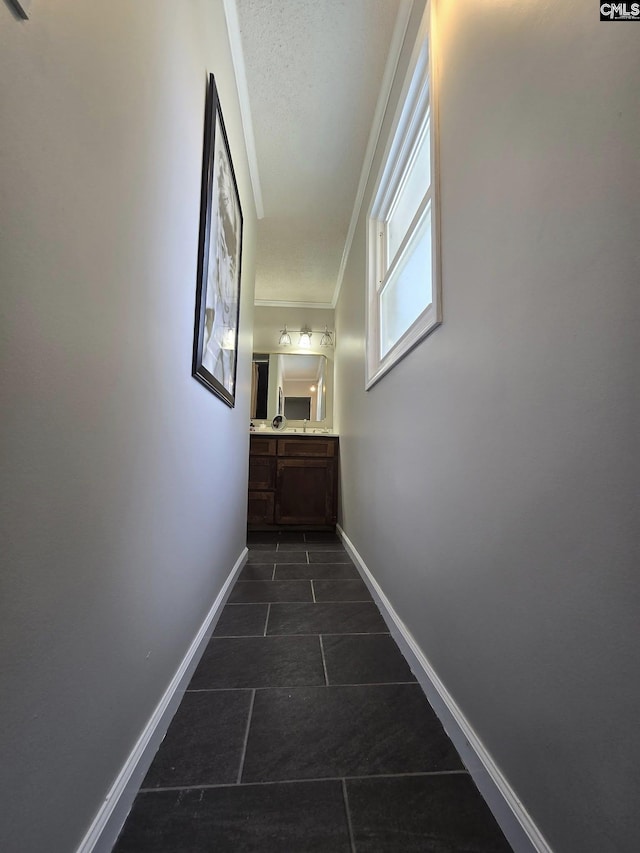 704 Cambridge, Lugoff, SC 29078 - hall featuring dark tile patterned flooring and ornamental molding