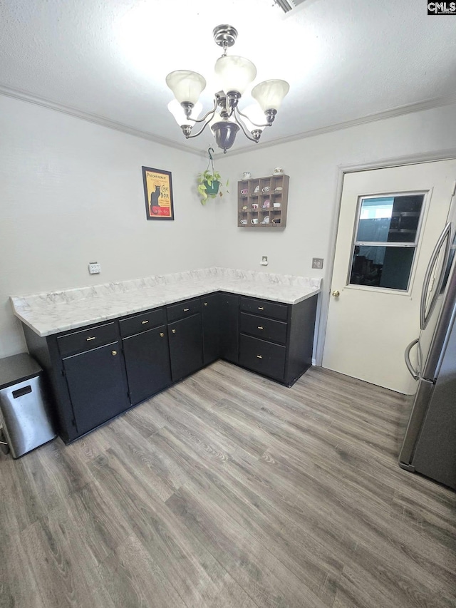 704 Cambridge, Lugoff, SC 29078 - unfurnished dining area with a chandelier and light wood finished floors