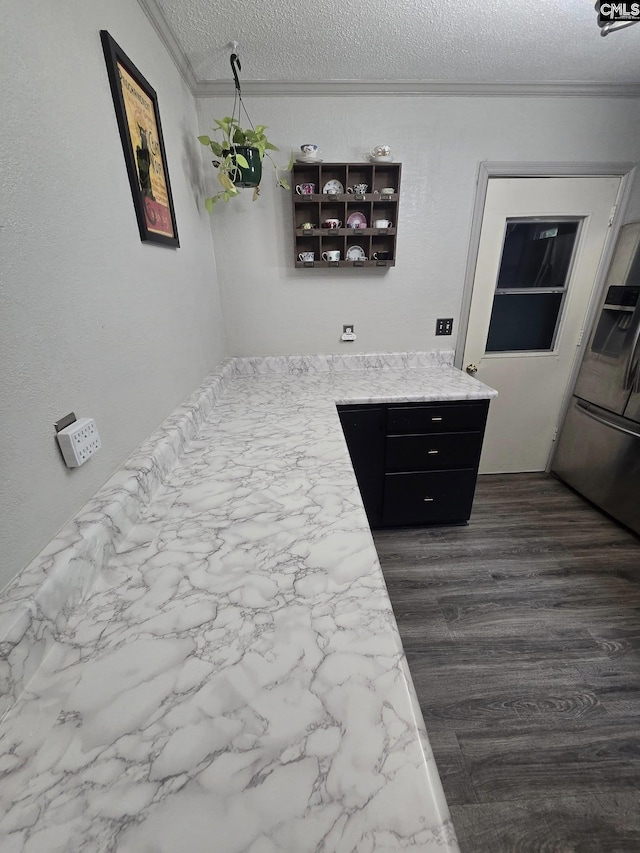 704 Cambridge, Lugoff, SC 29078 - bedroom with crown molding, a textured ceiling, dark wood-style flooring, and stainless steel fridge with ice dispenser