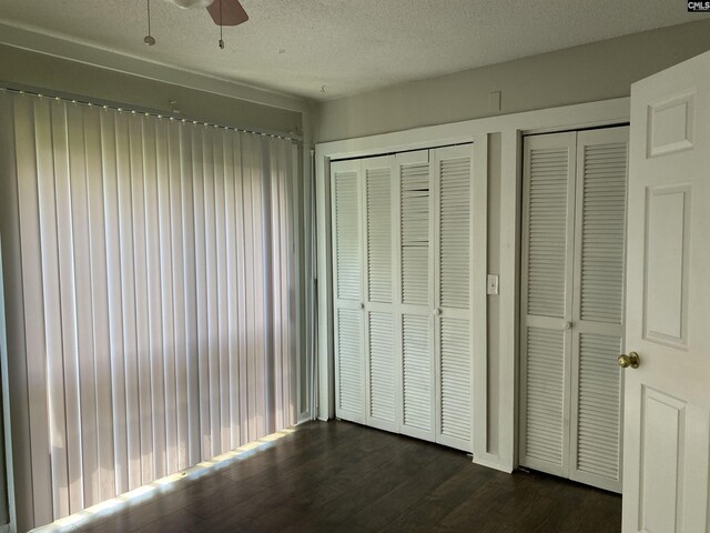 361 Hickory Hill Dr, Columbia, SC 29210 - unfurnished bedroom with dark wood-style floors and multiple closets
