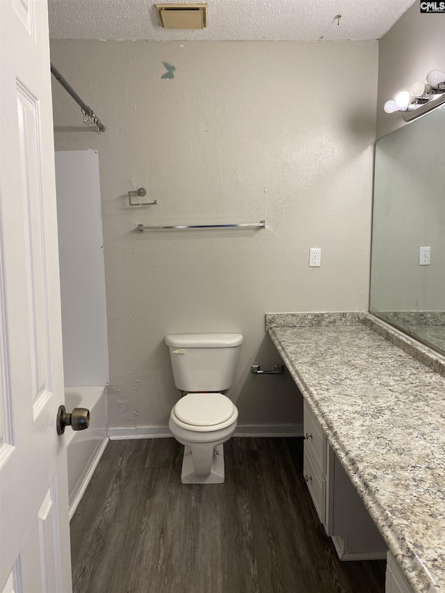 361 Hickory Hill Dr, Columbia, SC 29210 - full bath featuring wood finished floors, vanity, shower / washtub combination, and a textured ceiling