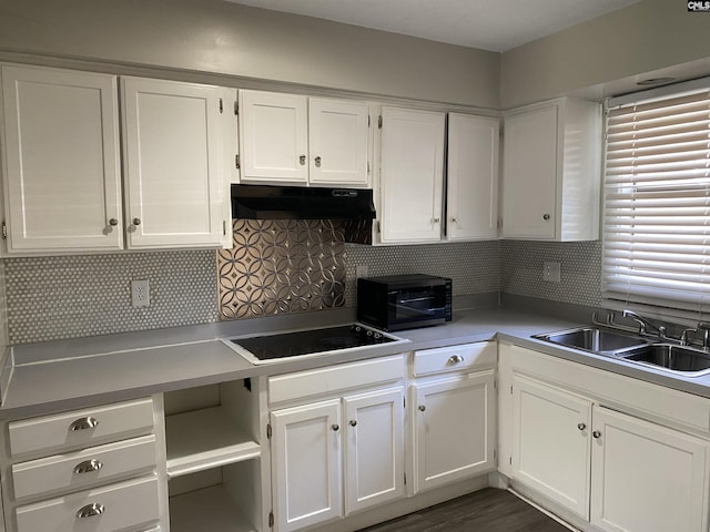 361 Hickory Hill Dr, Columbia, SC 29210 - kitchen with under cabinet range hood, black appliances, white cabinets, decorative backsplash, and light countertops