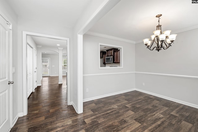 331 Aberlour Dr, Sumter, SC 29154 - unfurnished room with arched walkways, dark wood-type flooring, a chandelier, and crown molding